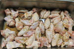 bowl of chicken wings marinating