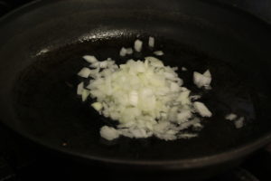 sauteeing onions in a pan