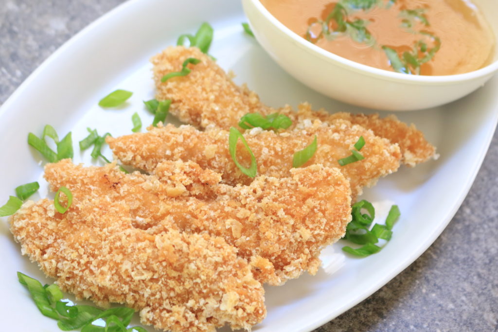 Gluten free and paleo chicken tenders with sweet and sour sauce