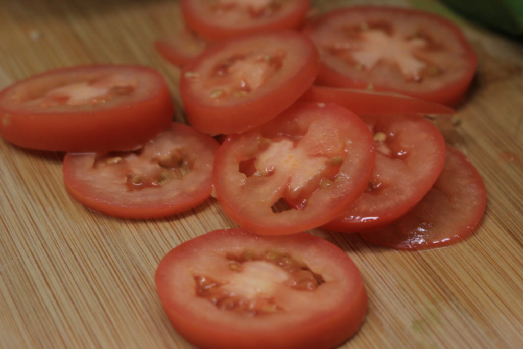 Sliced tomatoes go great on our paleo BLT wrap.