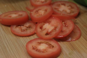 Sliced tomatoes go great on our paleo BLT wrap.