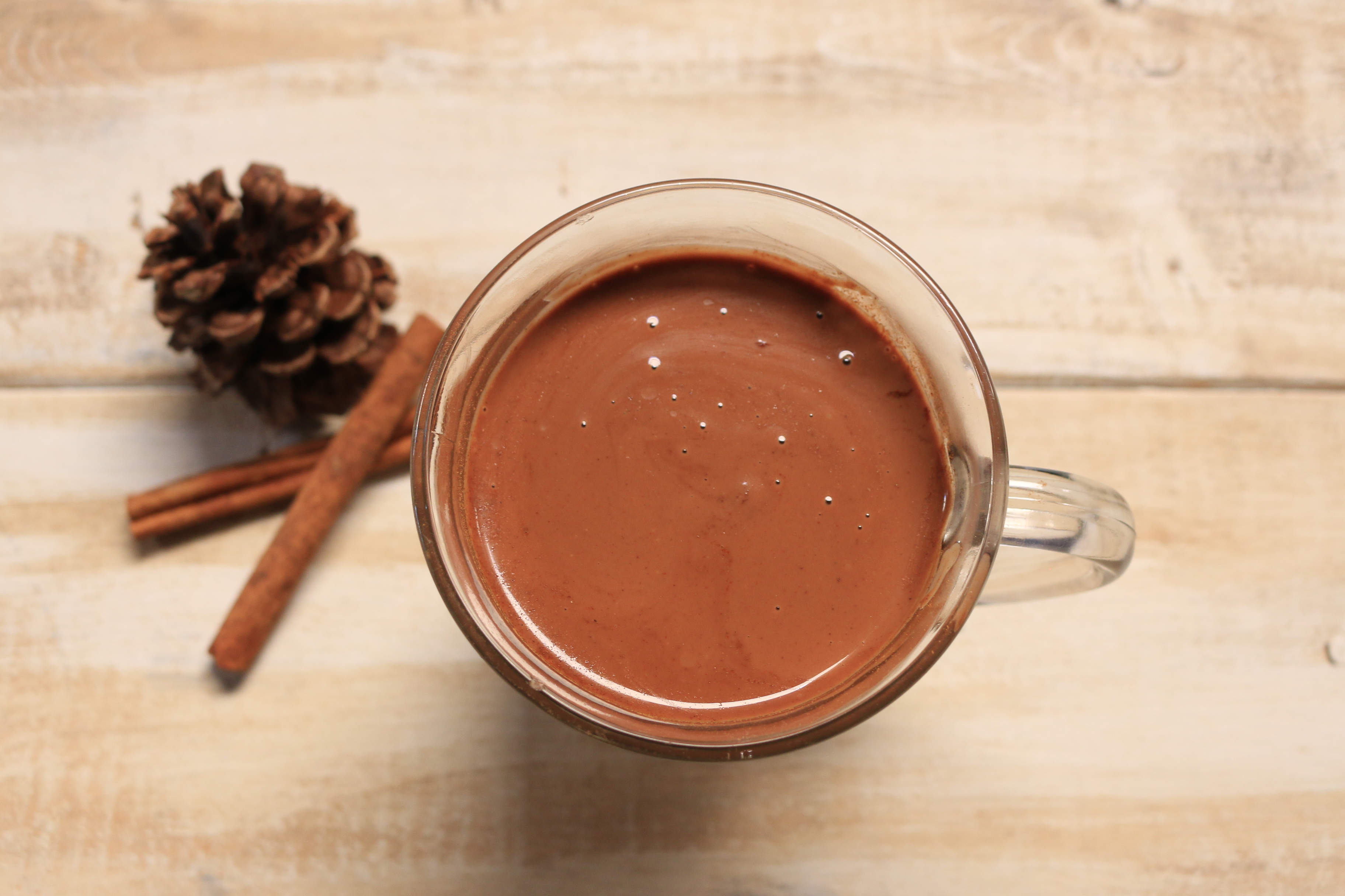 Dairy free paleo hot chocolate with a hint of cinnamon and sweetened with honey.